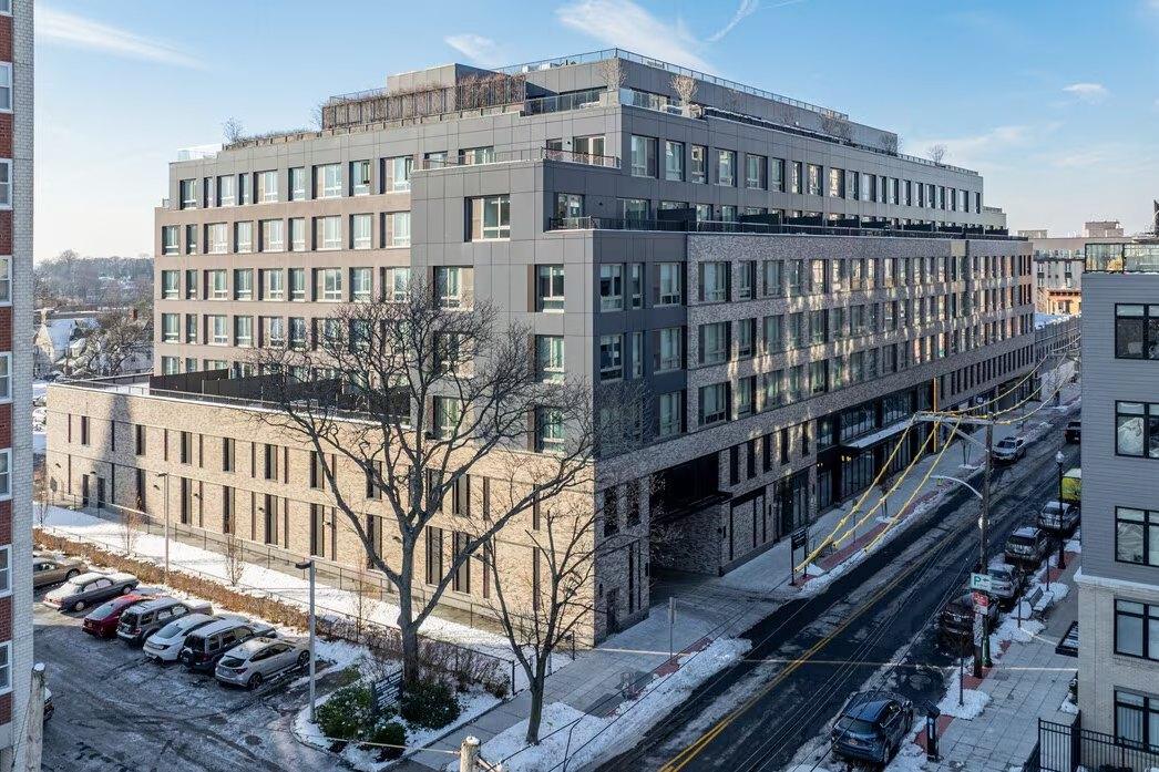 Elevated view of the full 25 Maple building and its rooftop terraces