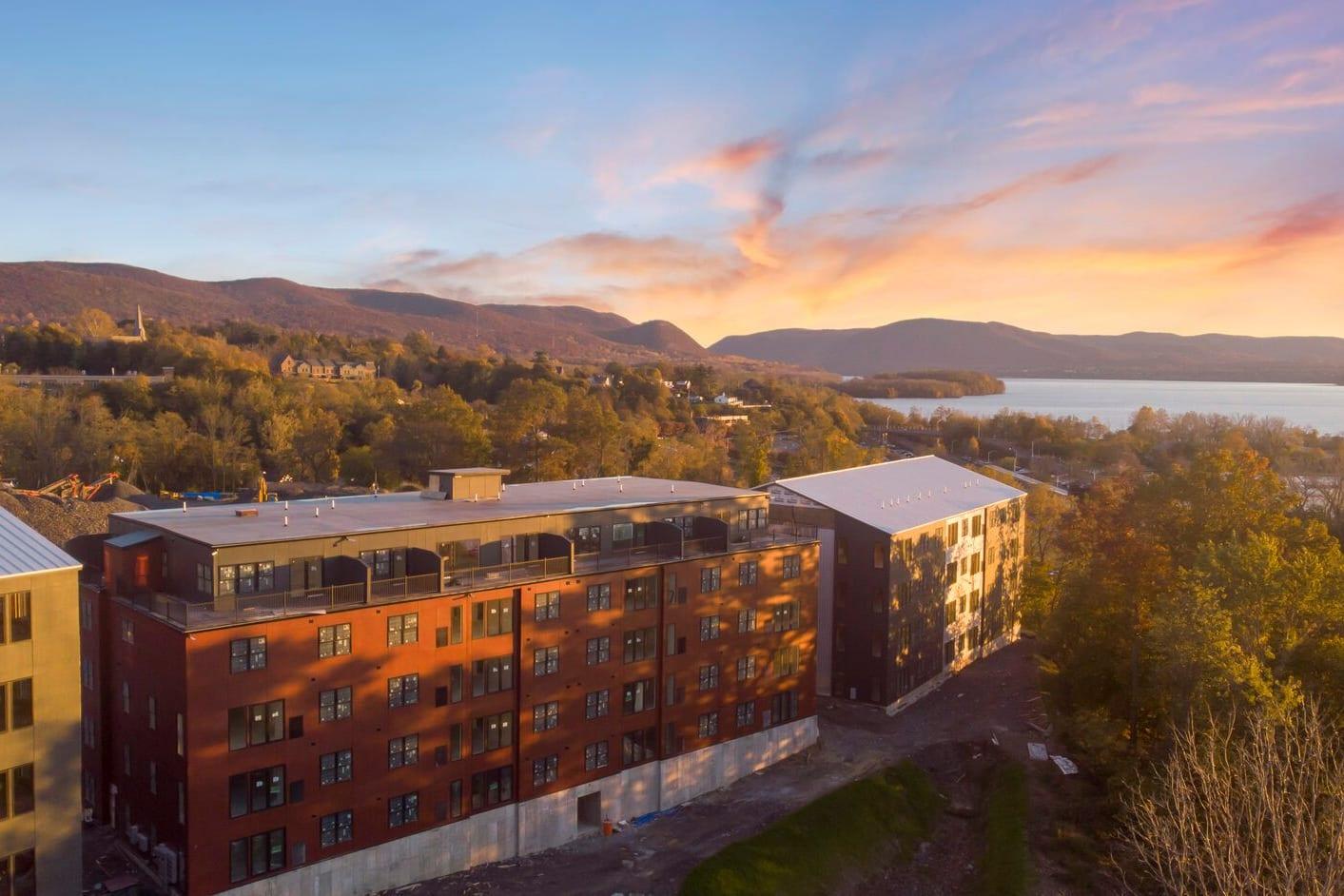 Aerial view of the Edgewater apartment buildings beside the Hudson River at sunset