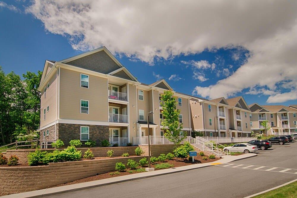 Row of Roundtop Commons apartment buildings along the entry drive